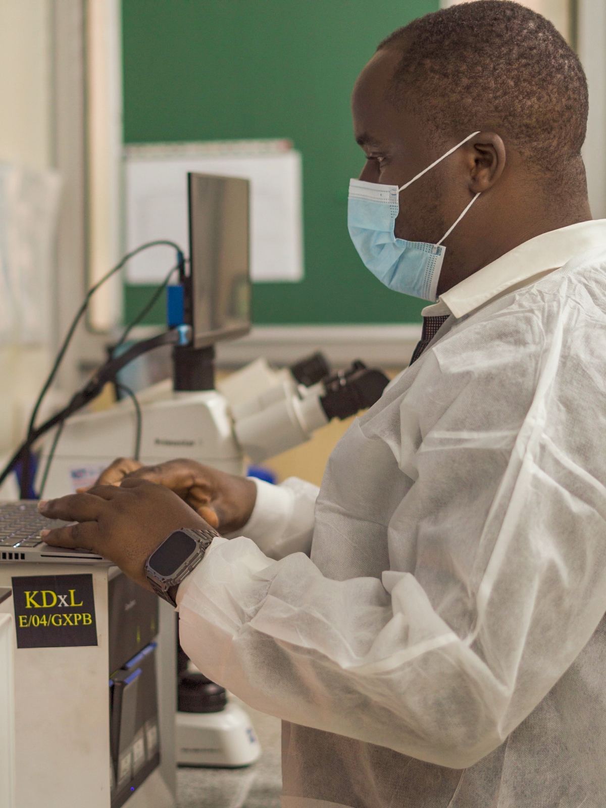 A Kebera scientist operating laboratory equipment