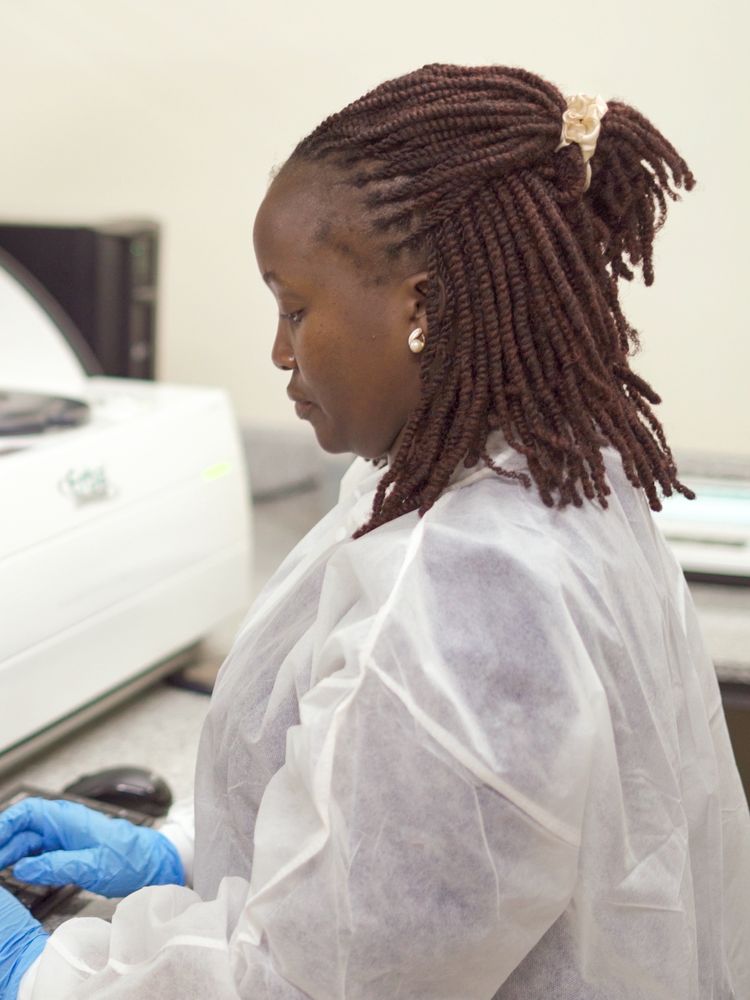 Laboratory scientist operating an analyser